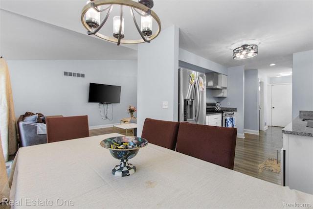2930 Wisconsin Rd, Troy, MI 48083 - dining space featuring dark wood-type flooring and a chandelier