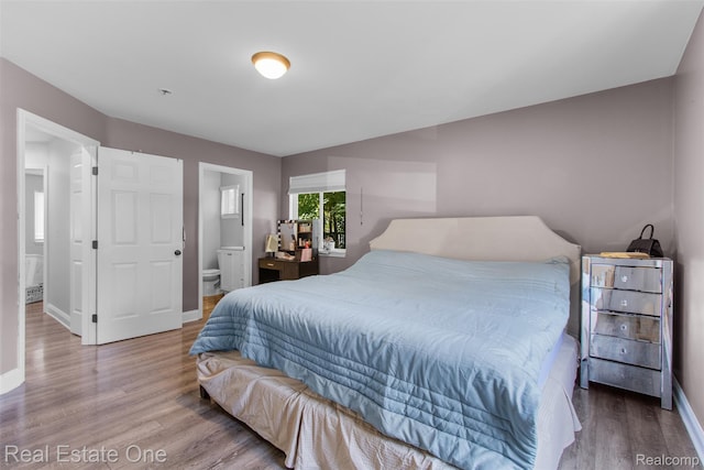 2930 Wisconsin Rd, Troy, MI 48083 - bedroom with wood finished floors and ensuite bath