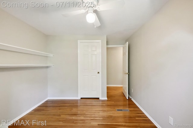 5910 Hillsboro Rd, Davisburg, MI 48350 - unfurnished room with wood finished floors and ceiling fan