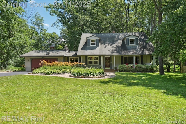 5910 Hillsboro Rd, Davisburg, MI 48350 - cape cod home with an attached garage, asphalt driveway, a front yard, and a chimney