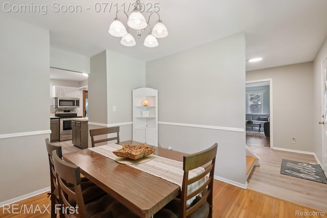 5910 Hillsboro Rd, Davisburg, MI 48350 - dining space with a chandelier, light wood-style flooring, and recessed lighting