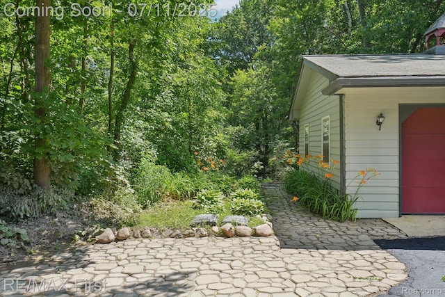5910 Hillsboro Rd, Davisburg, MI 48350 - property entrance with a patio