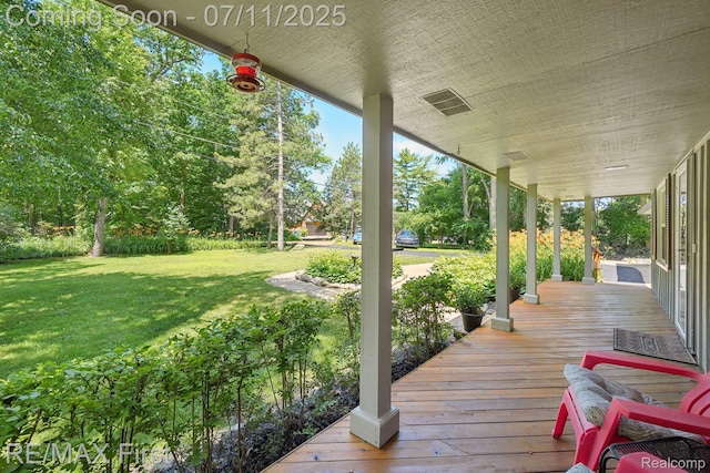 5910 Hillsboro Rd, Davisburg, MI 48350 - wooden porch featuring a lawn and view of scattered trees