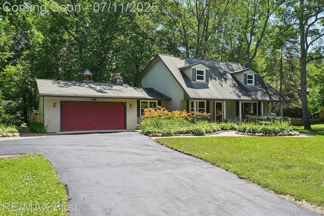 5910 Hillsboro Rd, Davisburg, MI 48350 - new england style home with driveway, a front yard, an attached garage, and a chimney