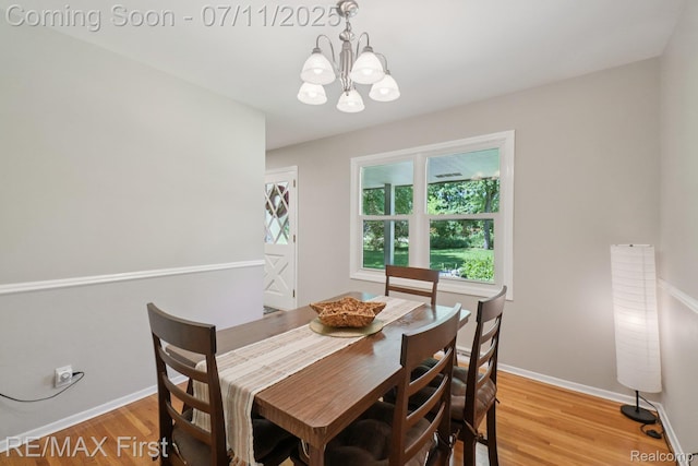 5910 Hillsboro Rd, Davisburg, MI 48350 - dining room with a chandelier and light wood-type flooring
