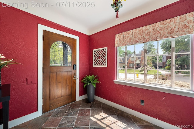 132 Illinois Ave, Pontiac, MI 48341 - foyer with a textured wall and stone tile flooring