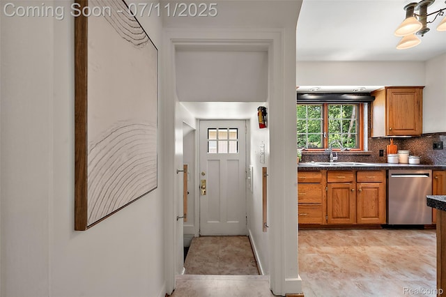 132 Illinois Ave, Pontiac, MI 48341 - kitchen featuring stainless steel dishwasher, brown cabinetry, dark countertops, and decorative backsplash