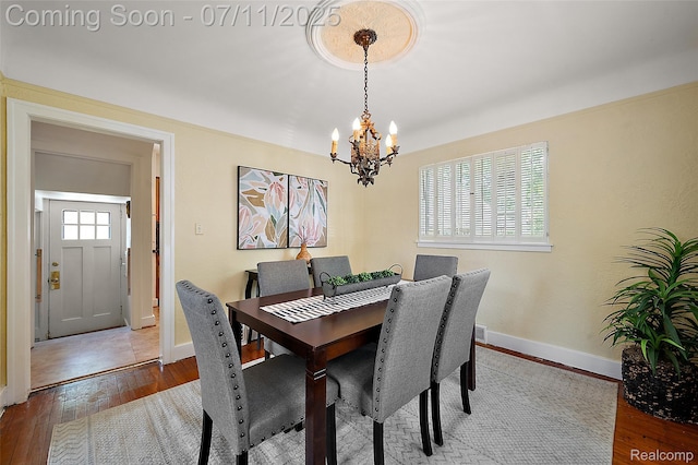 132 Illinois Ave, Pontiac, MI 48341 - dining area with a chandelier and hardwood / wood-style flooring