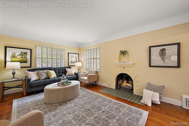 132 Illinois Ave, Pontiac, MI 48341 - living room with wood finished floors and a brick fireplace