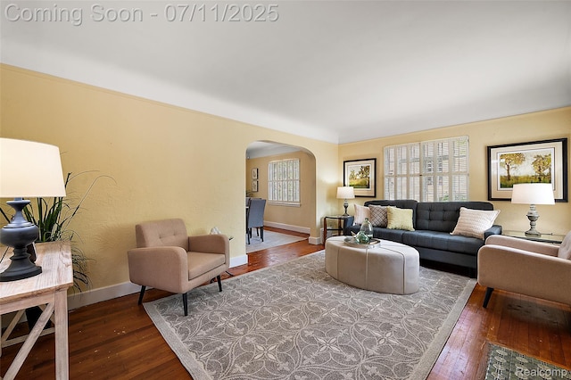 132 Illinois Ave, Pontiac, MI 48341 - living area featuring arched walkways and hardwood / wood-style floors