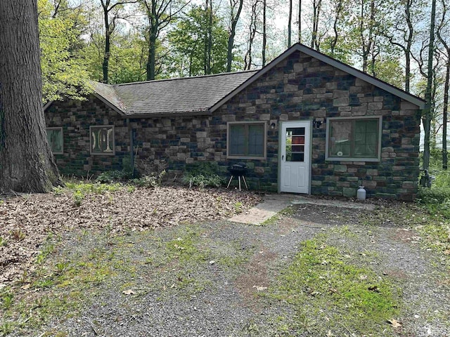 10931 Telegraph Rd, Erie, MI 48133 - view of front facade featuring stone siding and roof with shingles