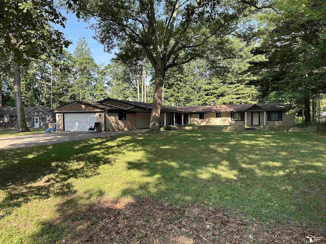 10931 Telegraph Rd, Erie, MI 48133 - ranch-style home featuring a garage, concrete driveway, and a front lawn