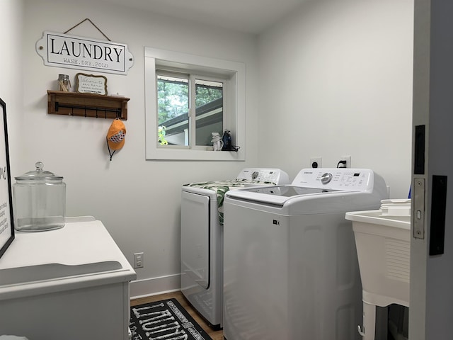 10931 Telegraph Rd, Erie, MI 48133 - washroom featuring washer and dryer and wood finished floors