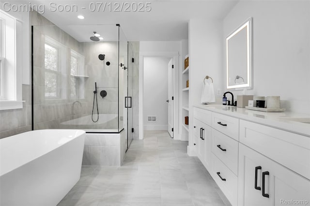 1212 Royal Ave, Royal Oak, MI 48073 - full bathroom with a shower stall, a soaking tub, vanity, and recessed lighting