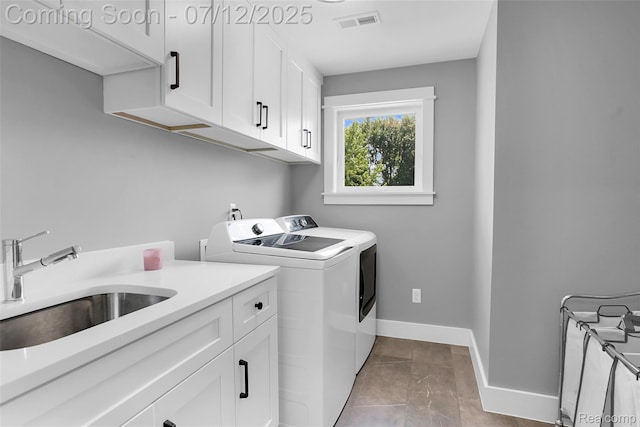 1212 Royal Ave, Royal Oak, MI 48073 - laundry area with cabinet space and washing machine and dryer