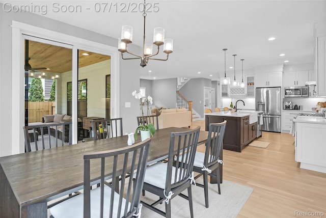 1212 Royal Ave, Royal Oak, MI 48073 - dining area featuring recessed lighting, light wood-style floors, a chandelier, stairway, and a ceiling fan