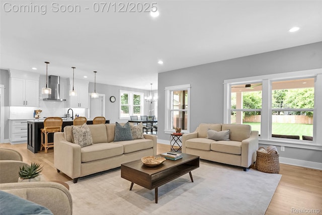 1212 Royal Ave, Royal Oak, MI 48073 - living room with recessed lighting, light wood-type flooring, and a chandelier
