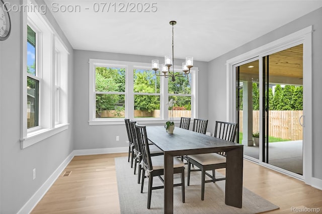 1212 Royal Ave, Royal Oak, MI 48073 - dining space with a chandelier and light wood-style flooring