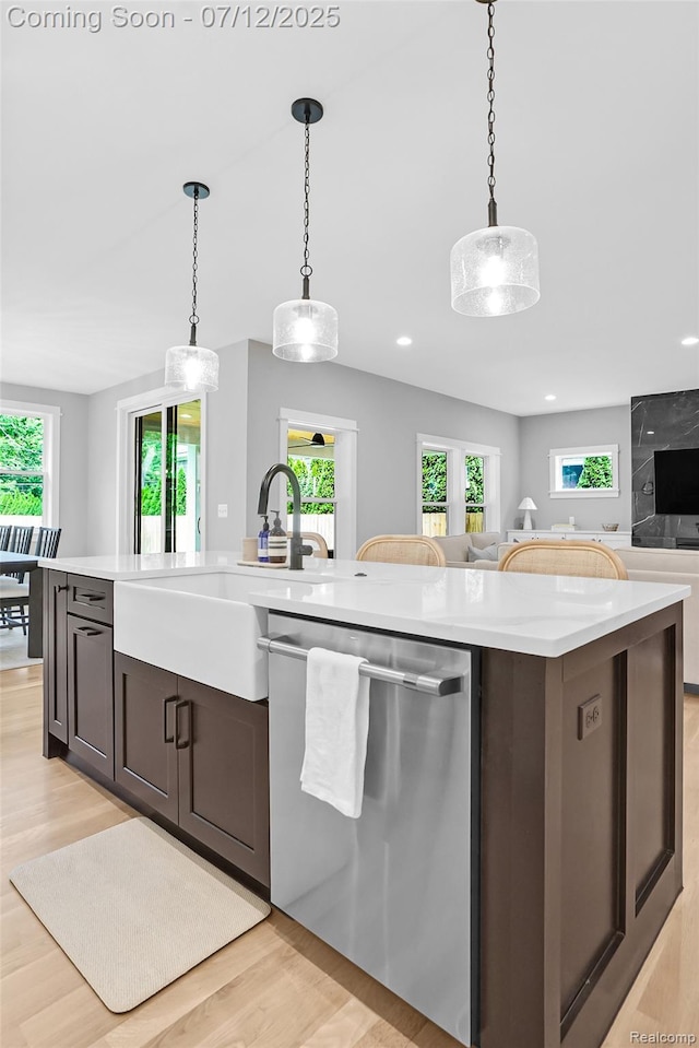 1212 Royal Ave, Royal Oak, MI 48073 - kitchen featuring dishwasher, light countertops, light wood finished floors, open floor plan, and recessed lighting