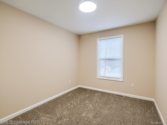 658 Beach St, Mount Morris, MI 48458 - unfurnished room featuring carpet and baseboards