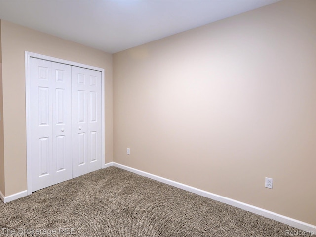 658 Beach St, Mount Morris, MI 48458 - unfurnished bedroom featuring carpet flooring and a closet