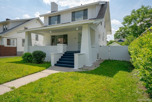 163 Moss St, Highland Park, MI 48203 - view of front of house with a porch, brick siding, a gate, and a chimney