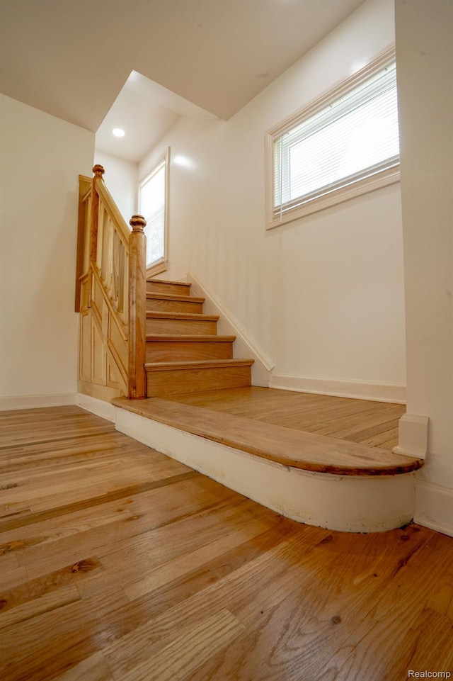 163 Moss St, Highland Park, MI 48203 - staircase with wood finished floors and recessed lighting