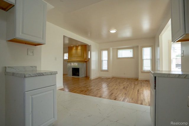 163 Moss St, Highland Park, MI 48203 - kitchen featuring light marble finish flooring, plenty of natural light, and light countertops