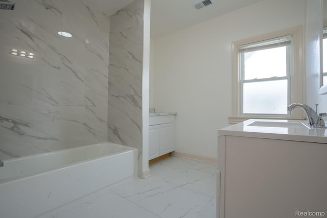 163 Moss St, Highland Park, MI 48203 - bathroom with vanity, marble look tiles, and tub / shower combination