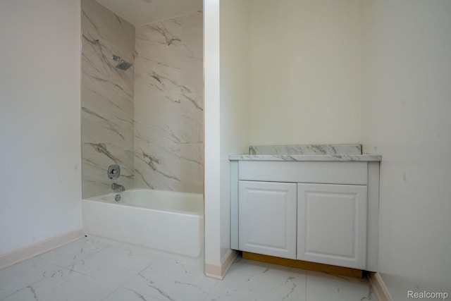163 Moss St, Highland Park, MI 48203 - bathroom featuring marble look tiles, vanity, and shower / bath combination