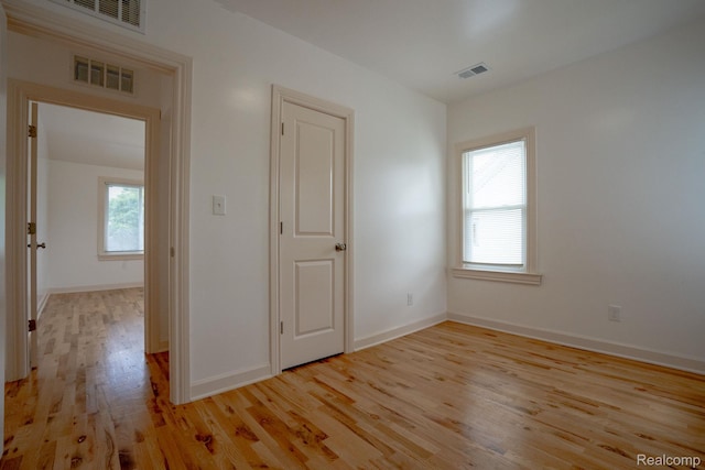 163 Moss St, Highland Park, MI 48203 - unfurnished bedroom featuring light wood-type flooring and baseboards