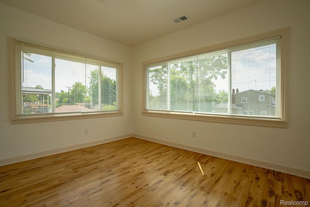 163 Moss St, Highland Park, MI 48203 - unfurnished room featuring baseboards and light wood-style floors