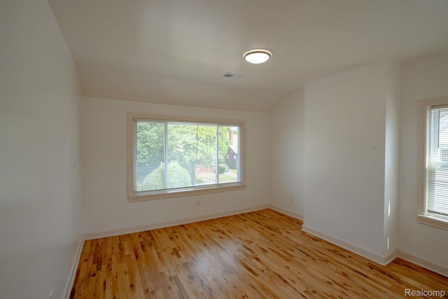 163 Moss St, Highland Park, MI 48203 - unfurnished room featuring light wood-style flooring and lofted ceiling