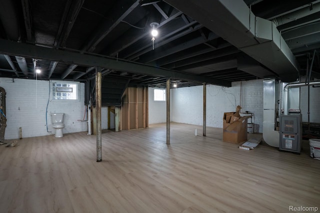 163 Moss St, Highland Park, MI 48203 - basement with heating unit and wood finished floors