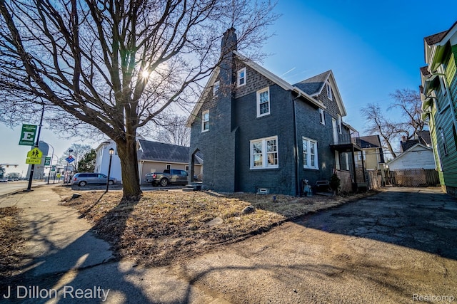 959 Washtenaw Rd, Ypsilanti, MI 48197 - view of front of house with a chimney and brick siding
