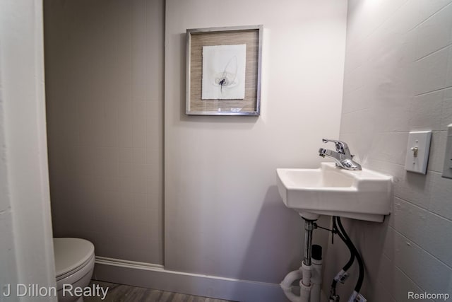 959 Washtenaw Rd, Ypsilanti, MI 48197 - bathroom featuring toilet and wood finished floors