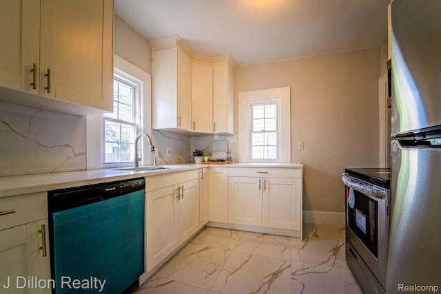 959 Washtenaw Rd, Ypsilanti, MI 48197 - kitchen with stainless steel appliances, healthy amount of natural light, backsplash, and light countertops