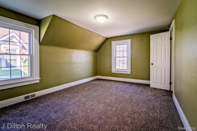 959 Washtenaw Rd, Ypsilanti, MI 48197 - bonus room with dark carpet and lofted ceiling