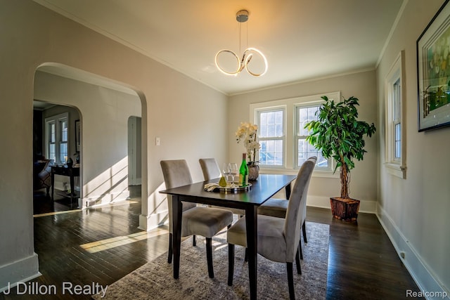 959 Washtenaw Rd, Ypsilanti, MI 48197 - dining room with wood-type flooring, arched walkways, a chandelier, and ornamental molding