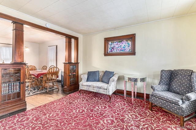 360 Burke St, River Rouge, MI 48218 - living area featuring decorative columns, wood finished floors, and ornamental molding