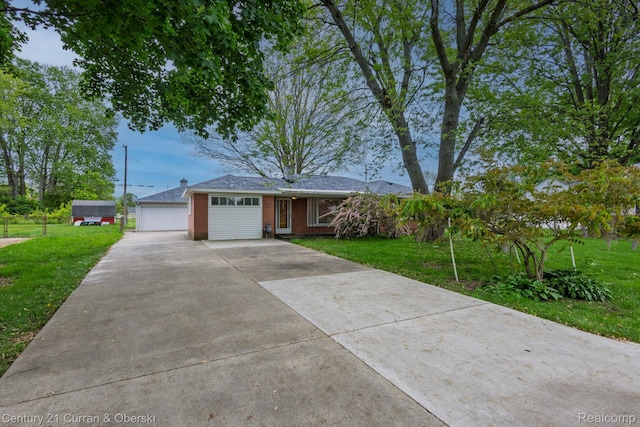 2548 Hearthside Dr, Ypsilanti, MI 48198 - ranch-style home featuring a front lawn, brick siding, and concrete driveway