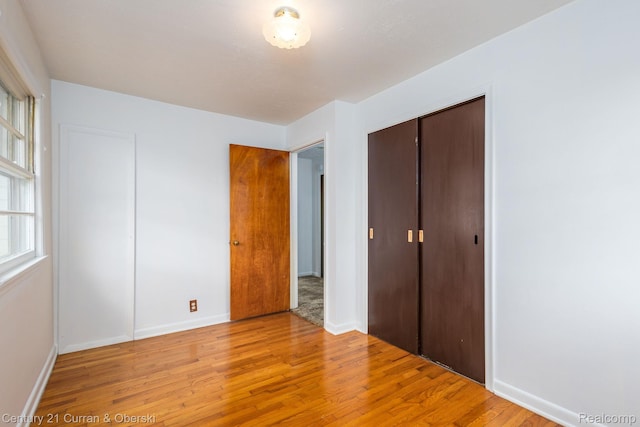 2548 Hearthside Dr, Ypsilanti, MI 48198 - unfurnished bedroom featuring light wood-style flooring and a closet
