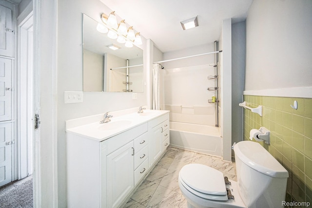 2904 Maplewood Ave, Ann Arbor, MI 48104 - bathroom featuring shower / bathtub combination, double vanity, tile walls, and marble look tile flooring
