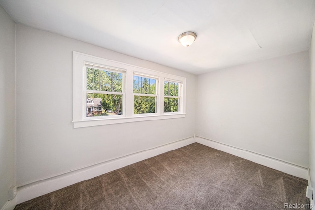 2904 Maplewood Ave, Ann Arbor, MI 48104 - empty room with dark carpet and baseboards