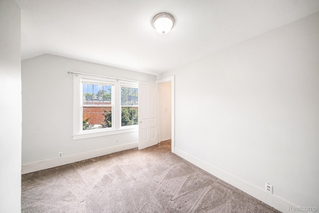 2904 Maplewood Ave, Ann Arbor, MI 48104 - spare room featuring carpet and vaulted ceiling