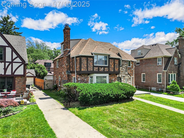 18024 Fairfield St, Redford, MI 48221 - tudor home featuring a chimney