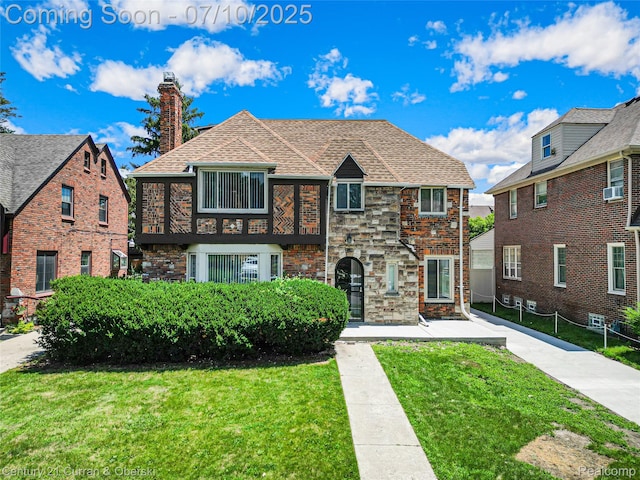 18024 Fairfield St, Redford, MI 48221 - view of front of home featuring a front yard, a chimney, and a shingled roof