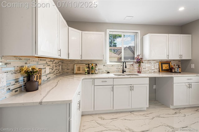 18024 Fairfield St, Redford, MI 48221 - kitchen with light marble finish floors, white cabinetry, light stone counters, and recessed lighting