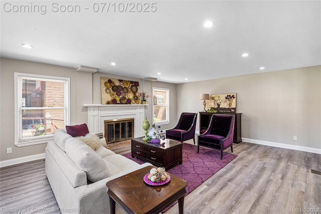 18024 Fairfield St, Redford, MI 48221 - living area with wood finished floors, a glass covered fireplace, and recessed lighting