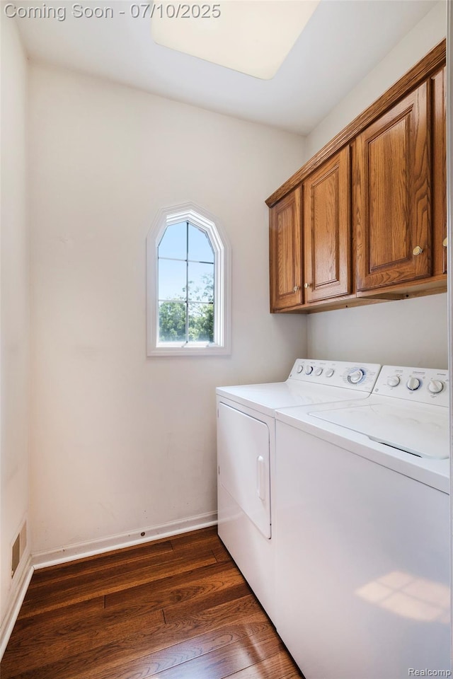 6161 Golfside Ct, Grand Blanc, MI 48439 - washroom with washing machine and dryer, cabinet space, and dark wood-style floors